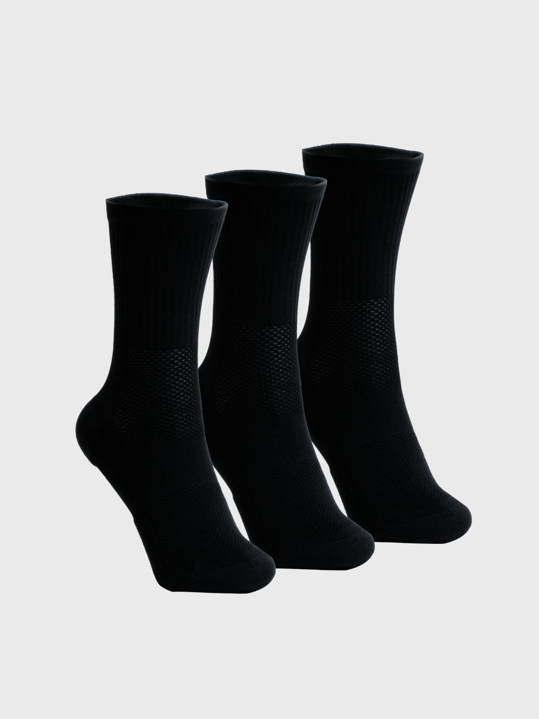 A three-pack bundle of black POP Running Co premium crew running socks, showing the sleek athletic design and reinforced construction.