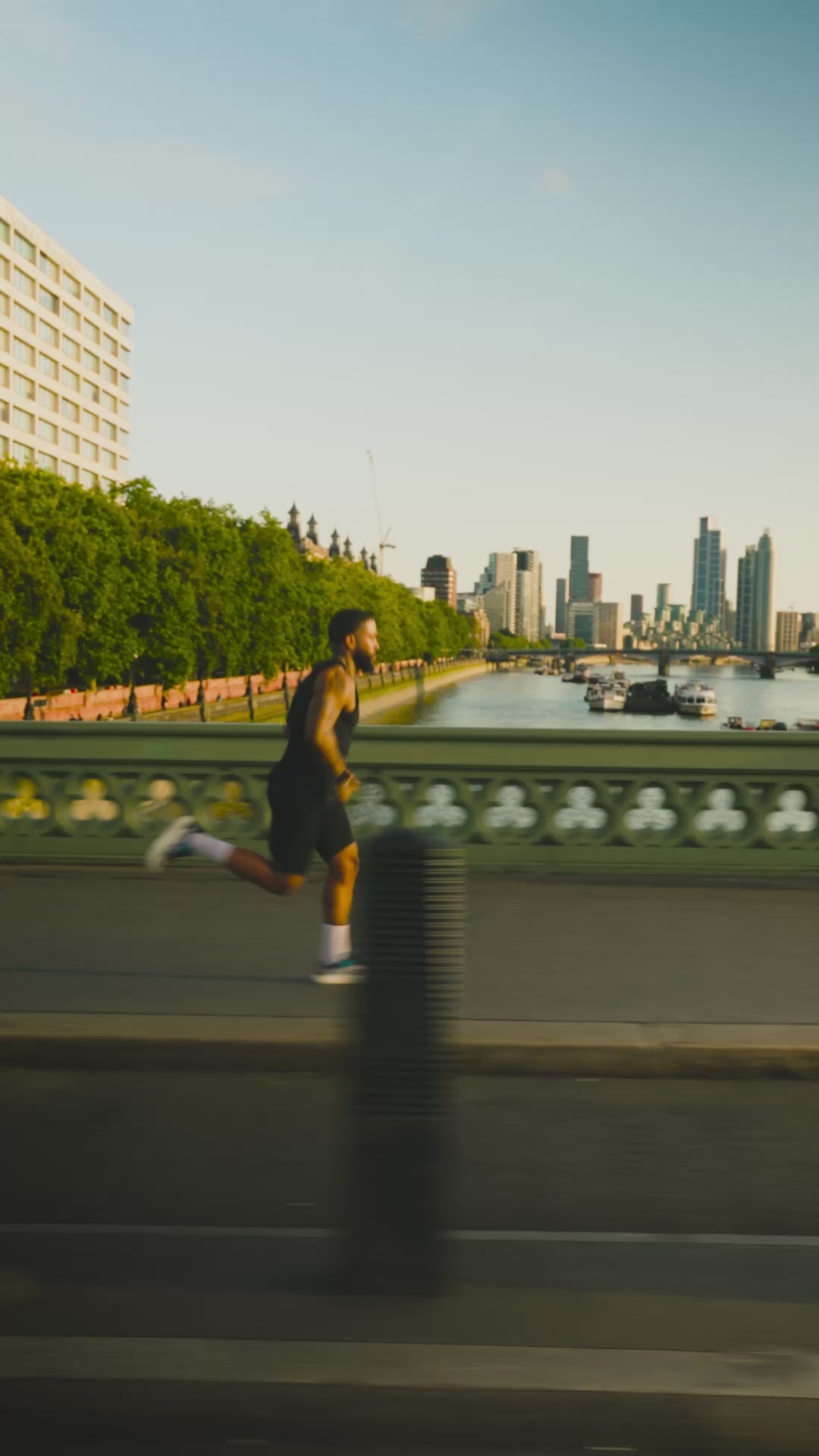 Cinematic video of a runner wearing white POP Running Co performance crew socks during a sunset run across a city bridge, highlighting the breathable fit and athletic style in motion.